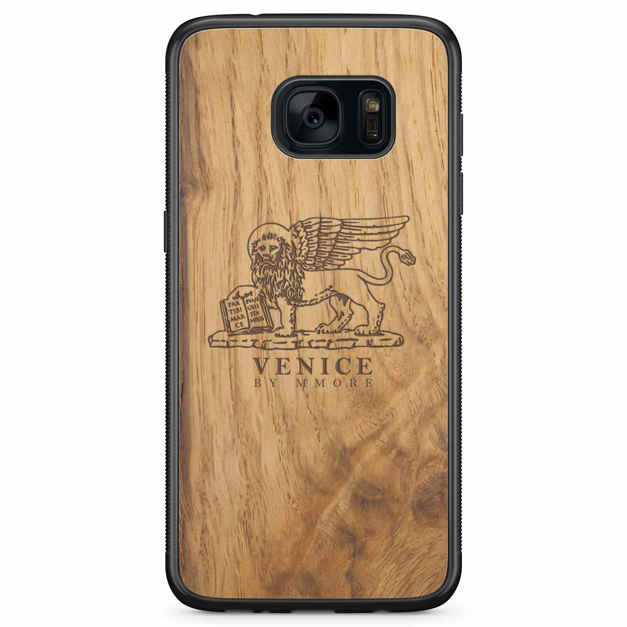 Handcrafted Venice phone case featuring the Lion of St. Marco, made from ancient oak wood, showcasing its unique grain and engraving.