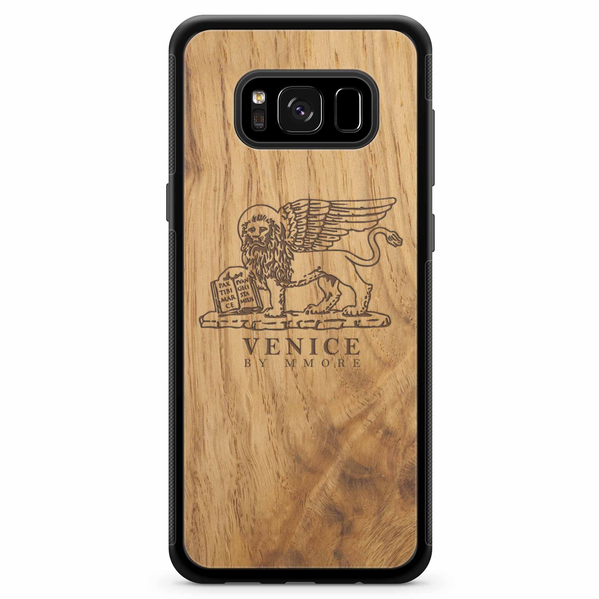 Handcrafted Venice phone case featuring the Lion of St. Marco, made from ancient oak wood, showcasing its unique grain and engraving.
