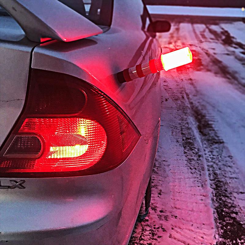 3-in-1 LED Roadside Flare kit with two flares and carrying case, showcasing their bright colors and magnetic bases.