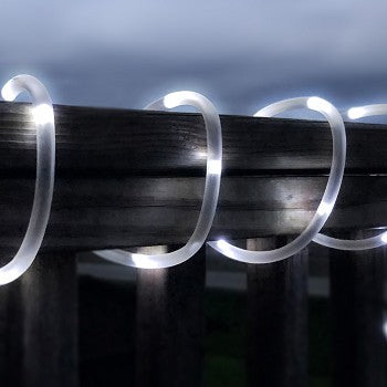 50 LED Bright White Solar Rope Light illuminating a garden pathway with vibrant white light.