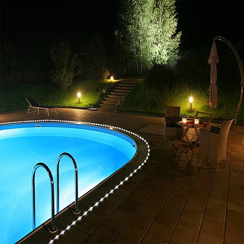 50 LED Bright White Solar Rope Light illuminating a garden pathway with vibrant white light.