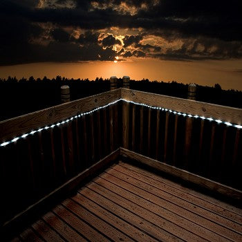 50 LED Bright White Solar Rope Light illuminating a garden pathway with vibrant white light.