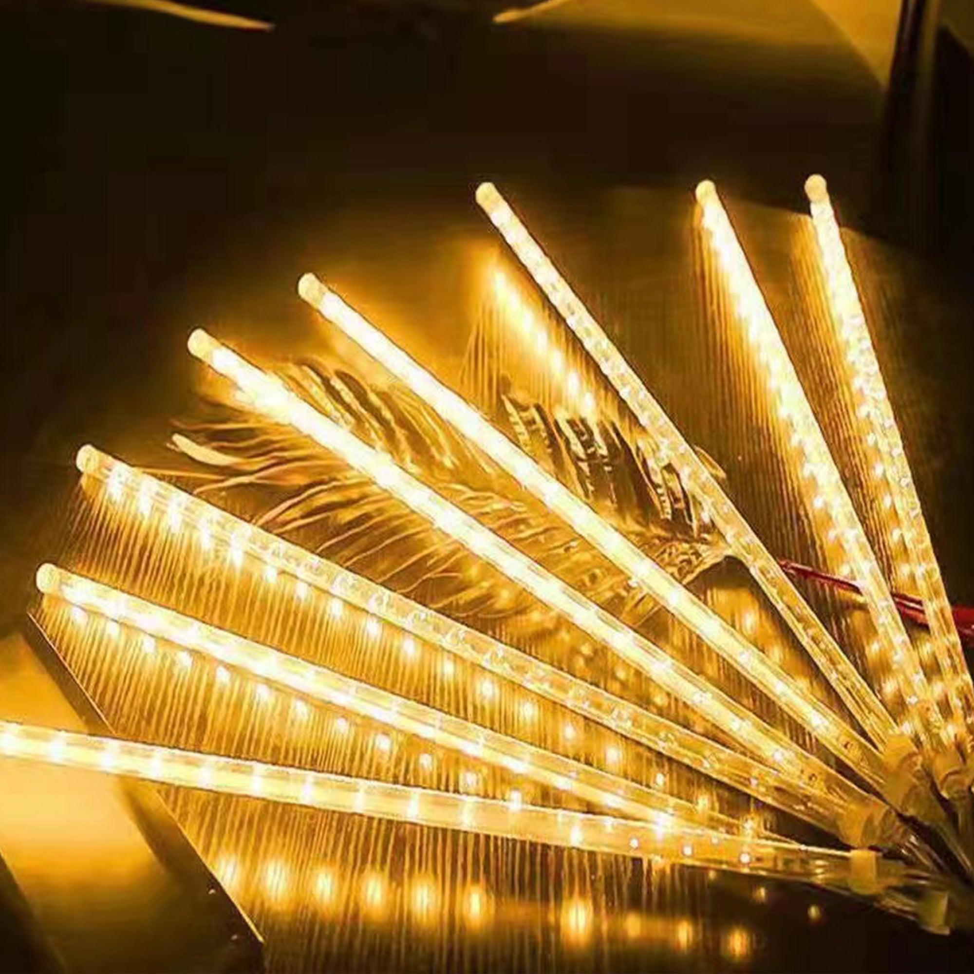 Pulg in Fairly String Lights LED Icicle Lights hanging outdoors, creating a stunning meteor shower effect with vibrant colors.