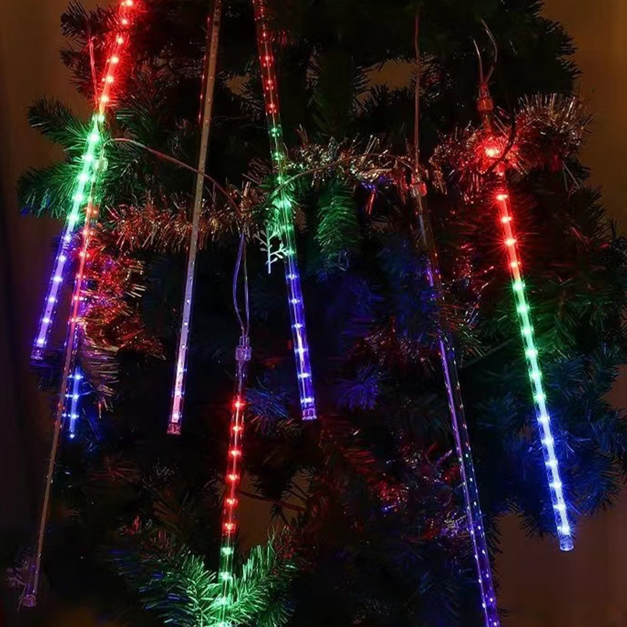 Pulg in Fairly String Lights LED Icicle Lights hanging outdoors, creating a stunning meteor shower effect with vibrant colors.