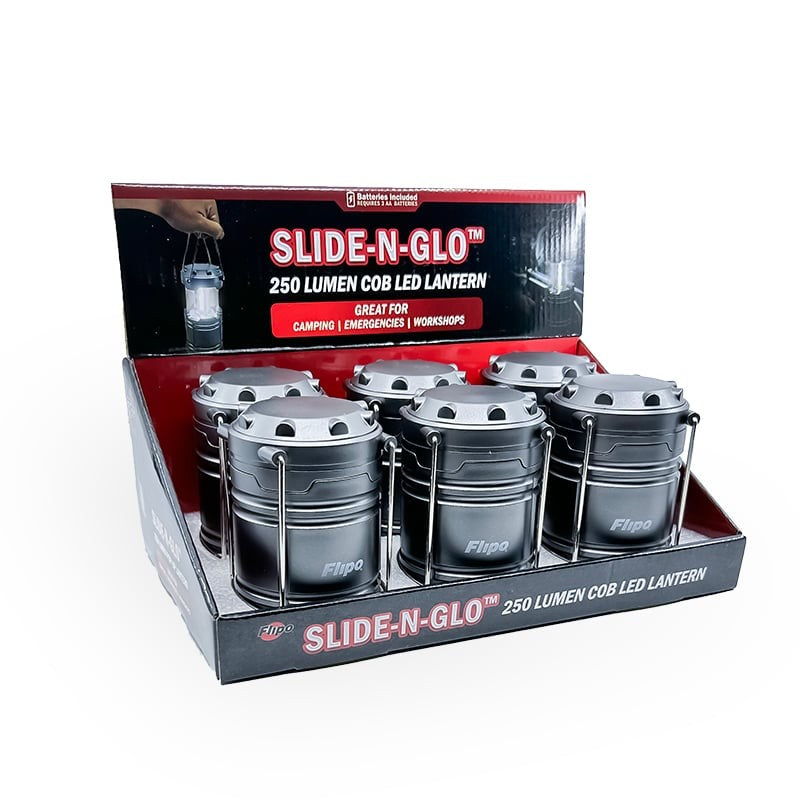 Slide-N-Glo COB LED Pop-Up Lantern displayed in a retail setting, showcasing its compact design and bright illumination.