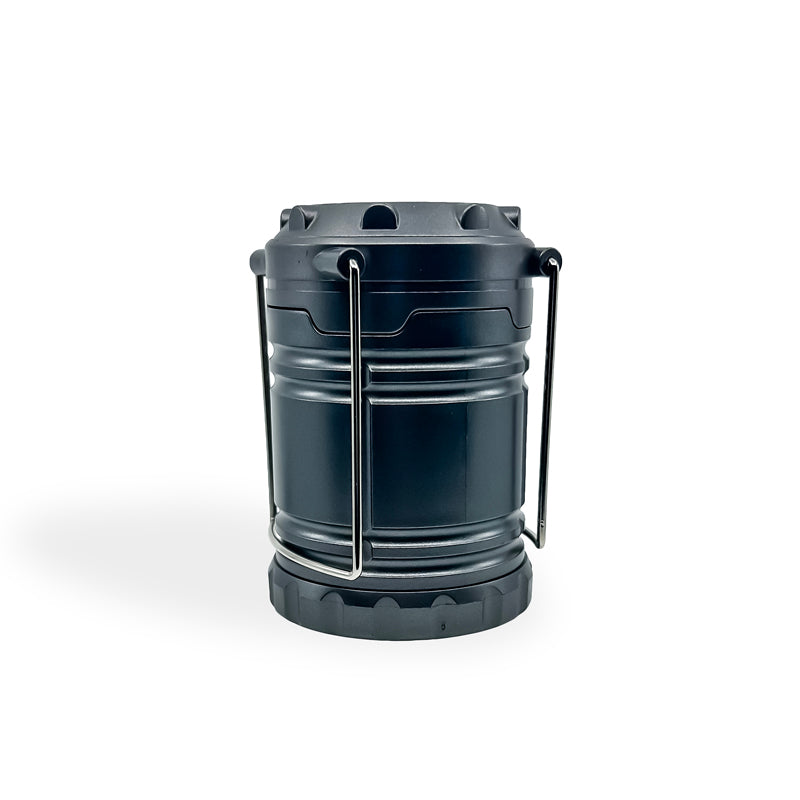 Slide-N-Glo™ COB LED Pop-Up Lantern in a compact design, showcasing its pull-up feature and bright LED light, ideal for outdoor adventures.