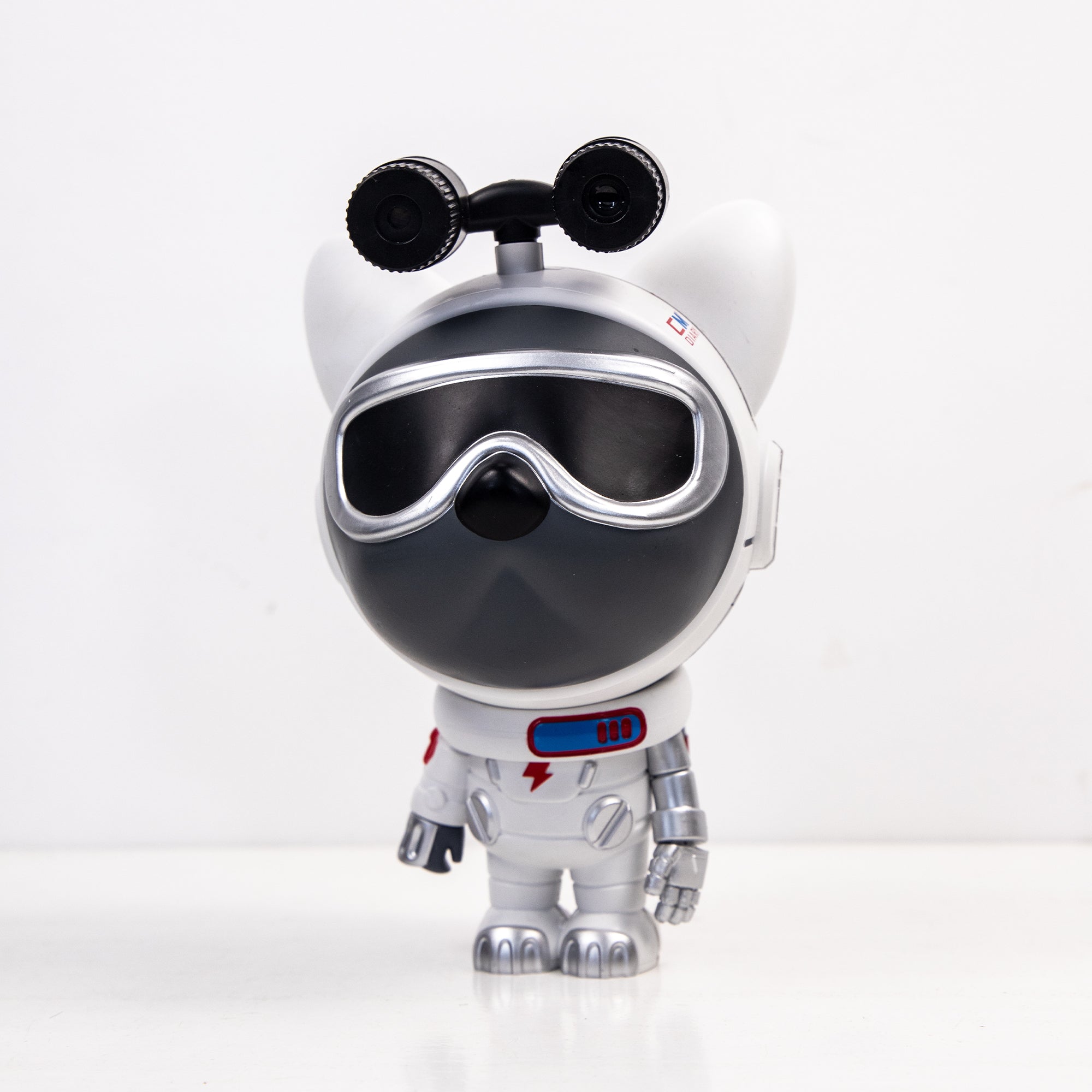 Star Projector Lamp featuring a cute dog astronaut design, projecting colorful nebula patterns onto the ceiling.