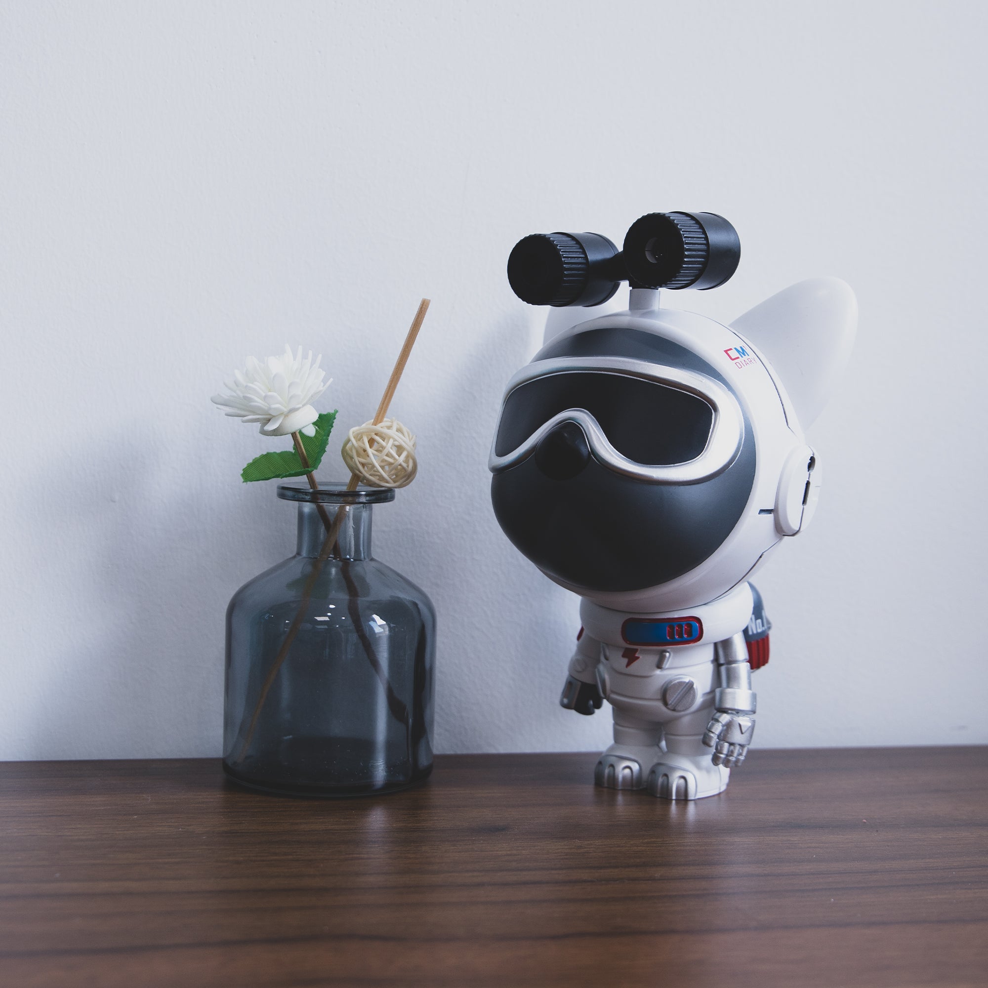 Star Projector Lamp featuring a cute dog astronaut design, projecting colorful nebula patterns onto the ceiling.