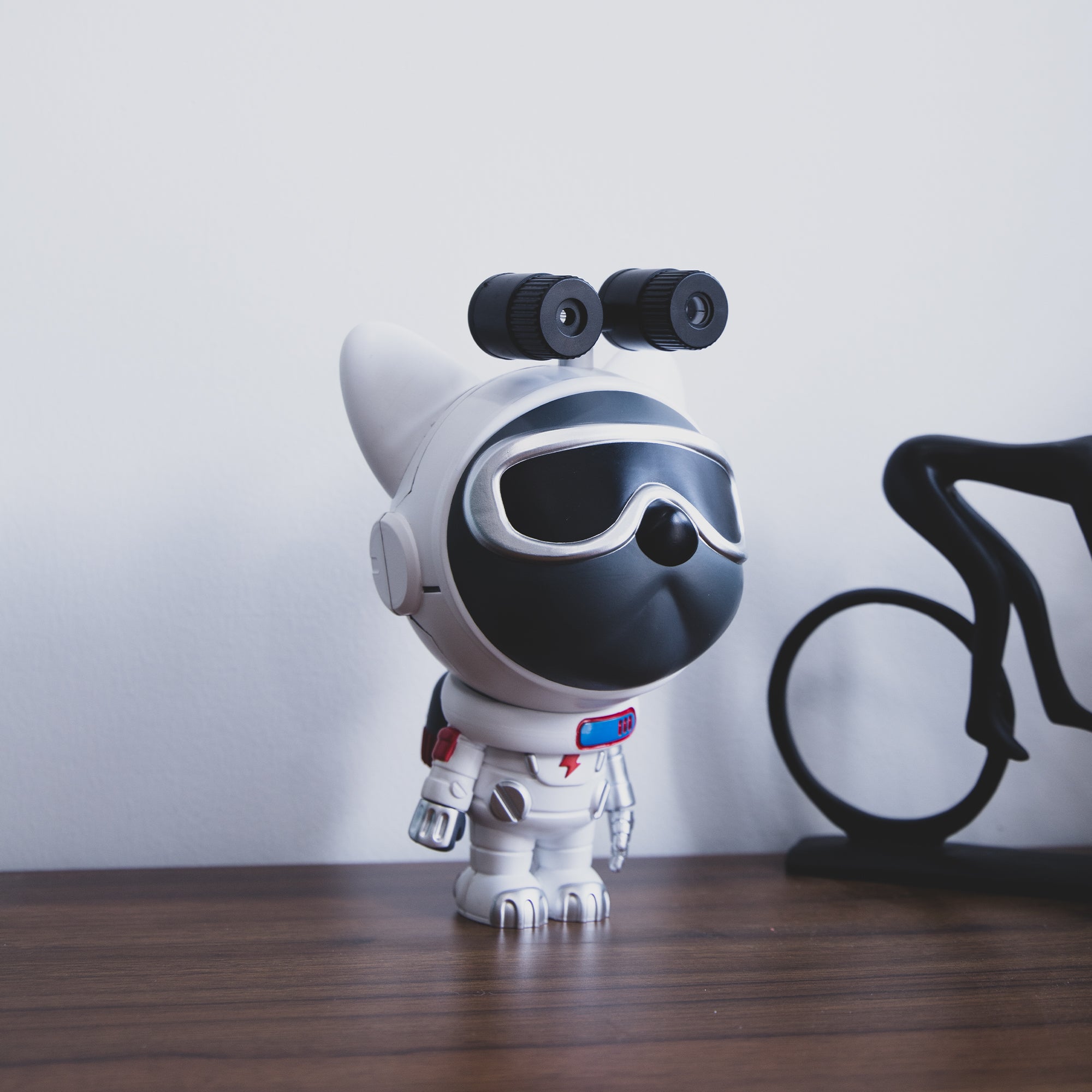 Star Projector Lamp featuring a cute dog astronaut design, projecting colorful nebula patterns onto the ceiling.