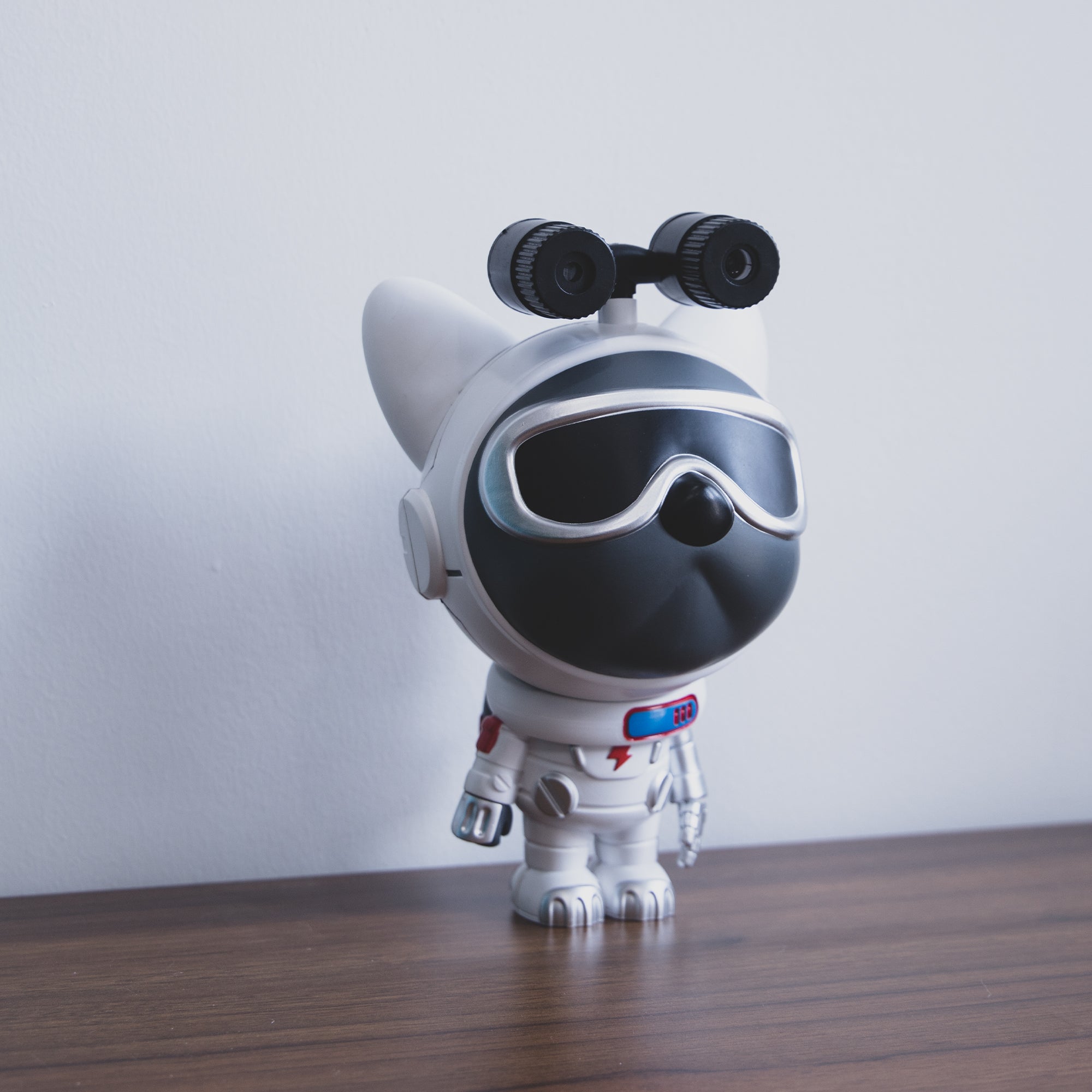 Star Projector Lamp featuring a cute dog astronaut design, projecting colorful nebula patterns onto the ceiling.