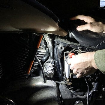 Vulcan Dual Zoom Work Light showcasing its compact design, ergonomic grip, and multiple lighting features.