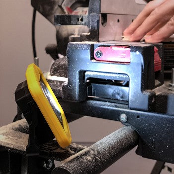 Vulcan Dual Zoom Work Light showcasing its compact design, ergonomic grip, and multiple lighting features.