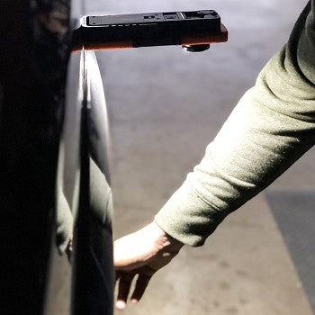 Vulcan Dual Zoom Work Light showcasing its compact design, ergonomic grip, and multiple lighting features.