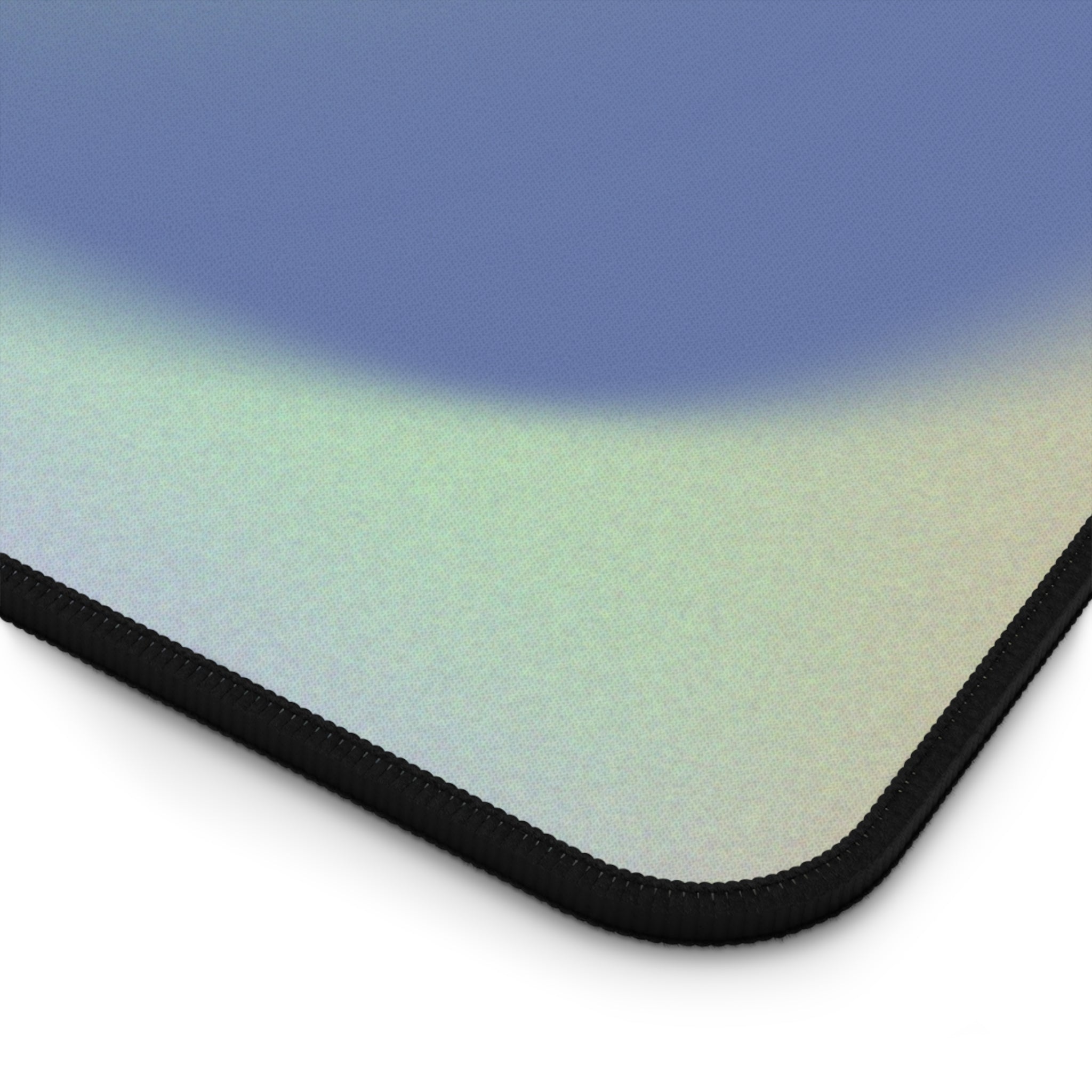 Green Glowing Swirls Desk Mat featuring vibrant swirls and a smooth surface, ideal for gaming and office use.