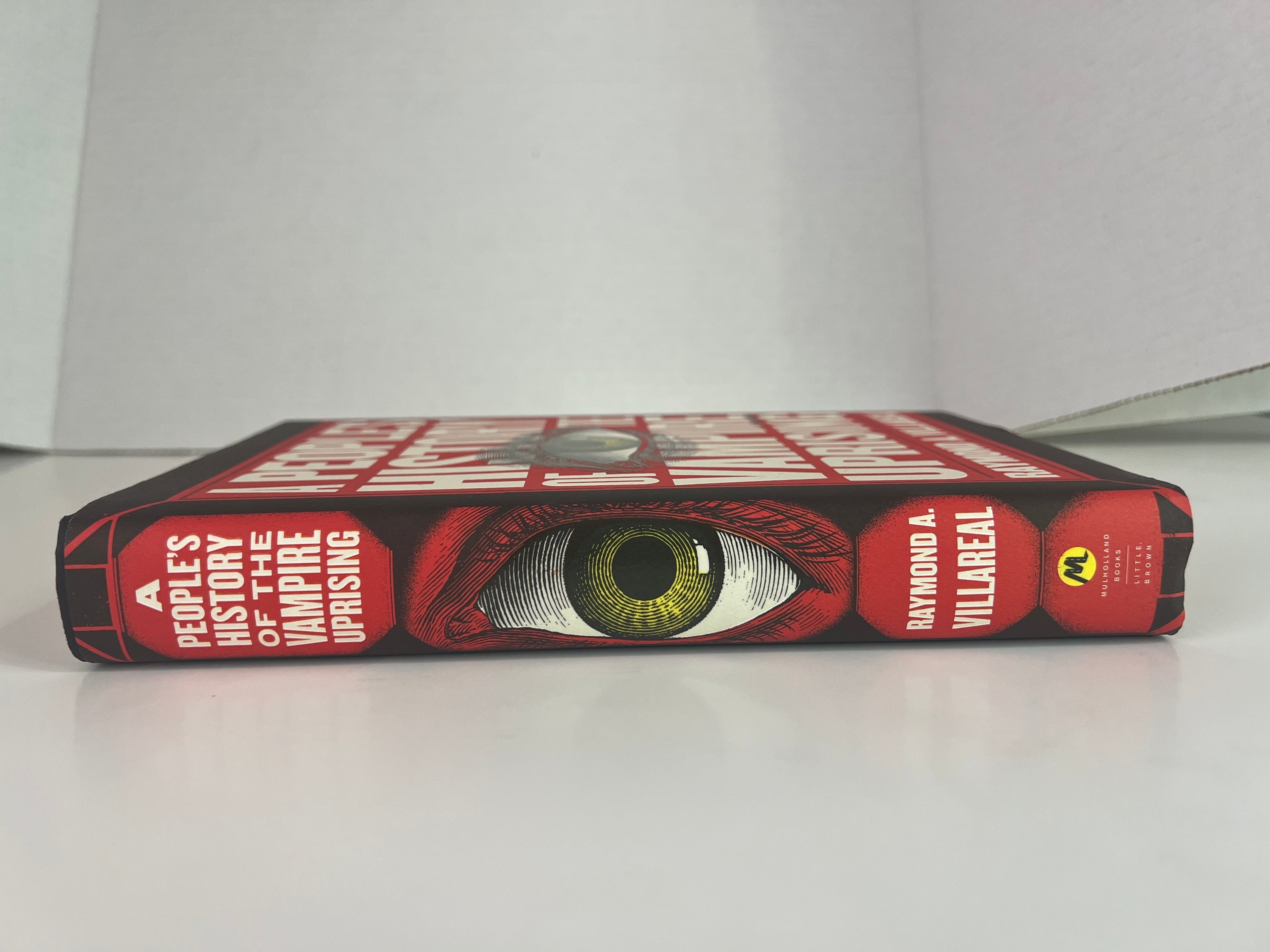 Cover of A People's History of the Vampire Uprising novel by Raymond A., featuring a dark and mysterious design with vampire imagery.