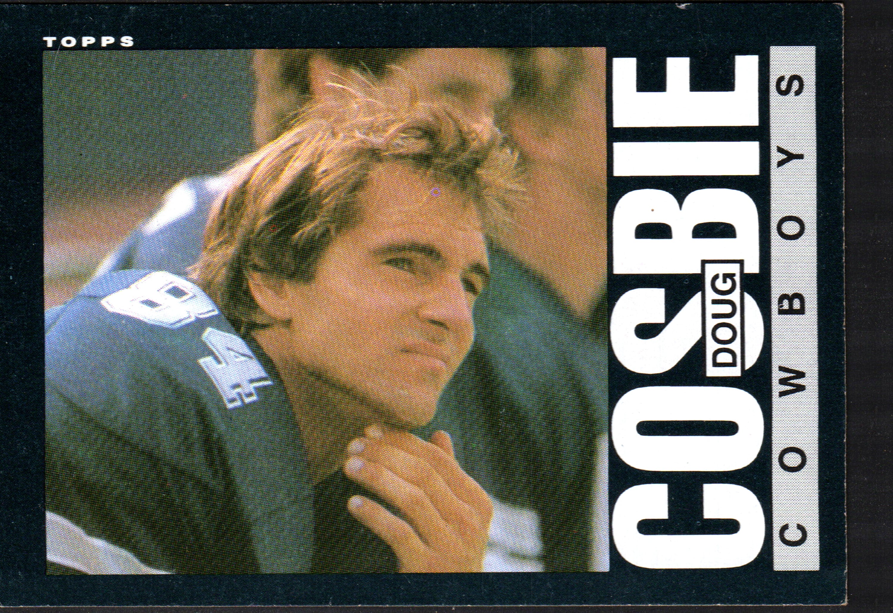 1985 Topps Doug Cosbie trading card featuring the Dallas Cowboys tight end in action.