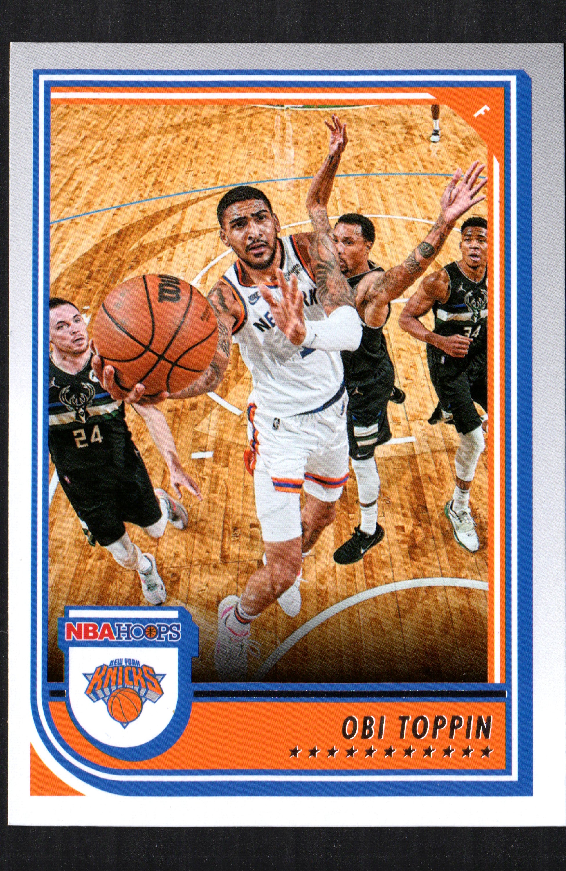 Obi Toppin New York Knicks #21 trading card from the 2022-23 Panini NBA Hoops set, featuring vibrant colors and detailed player information.