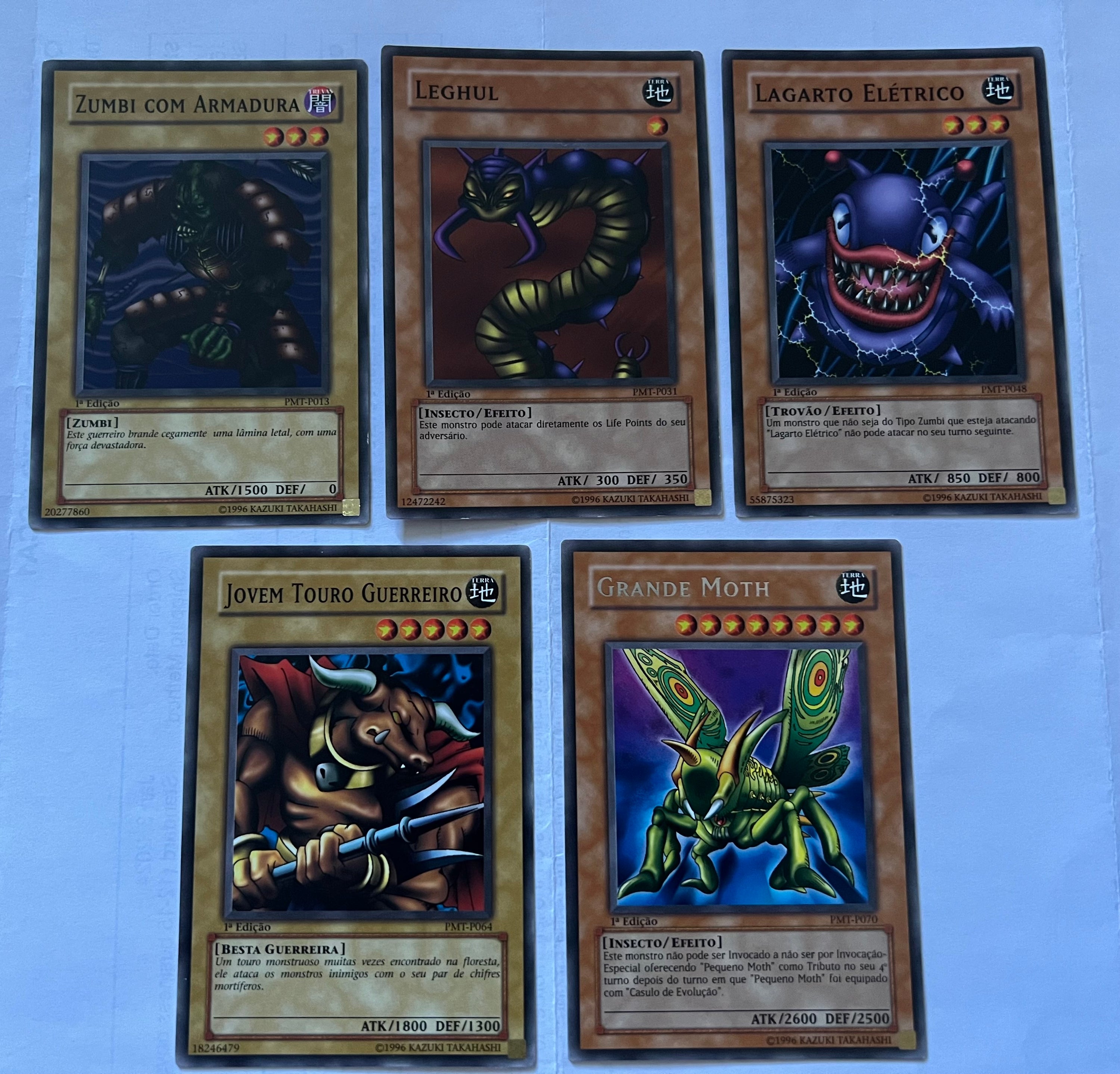 A collection of 9 Portuguese Yu-Gi-Oh! Metal Raiders cards from the Ancient Sanctuary set, showcasing unique designs and characters.