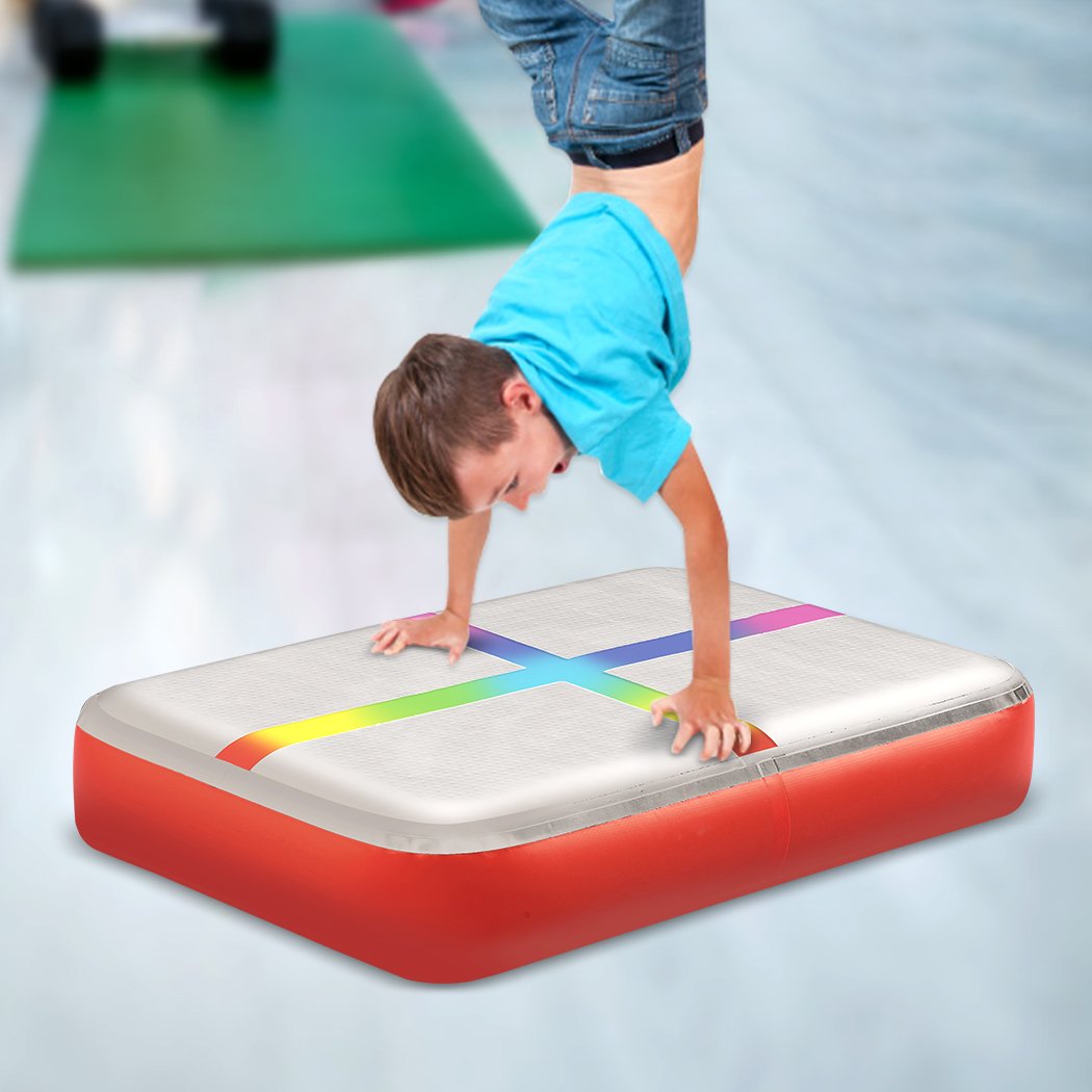 0.6M x 1M inflatable air track block in red, designed for gymnastics and cheerleading training with anti-slip surface.