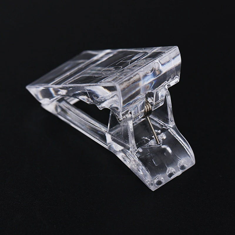 A set of 10 transparent acrylic nail tips clips designed for quick building of poly builder gel extensions, showcasing ergonomic design and sturdy construction.