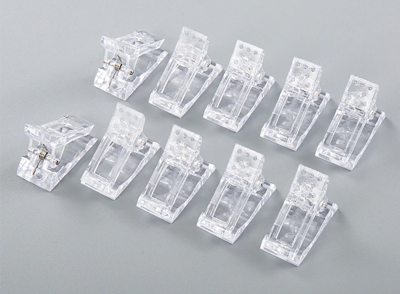 A set of 10 transparent acrylic nail tips clips designed for quick building of poly builder gel extensions, showcasing ergonomic design and sturdy construction.