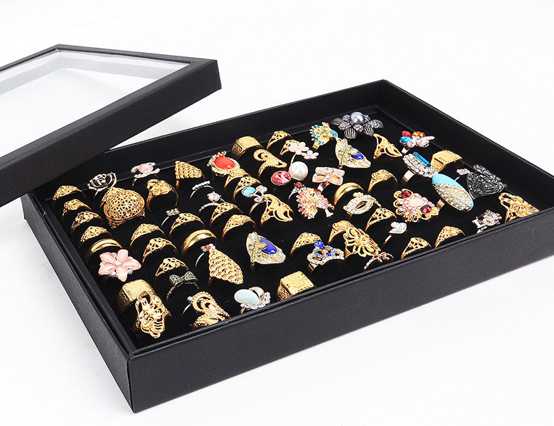 100 Slots Jewelry Ring Display Organizer Tray with transparent cover, showcasing rings and earrings in an elegant black design.