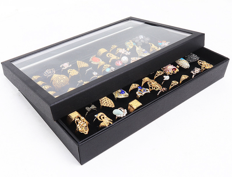100 Slots Jewelry Ring Display Organizer Tray with transparent cover, showcasing rings and earrings in an elegant black design.