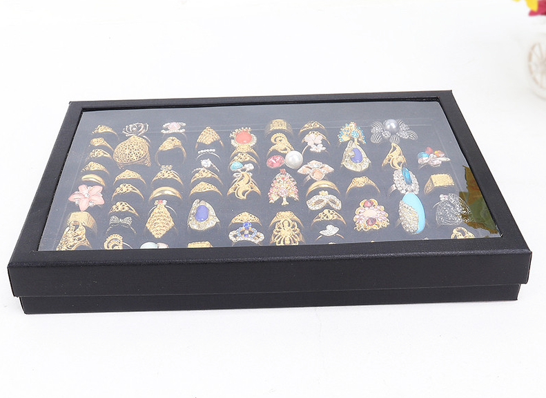 100 Slots Jewelry Ring Display Organizer Tray with transparent cover, showcasing rings and earrings in an elegant black design.