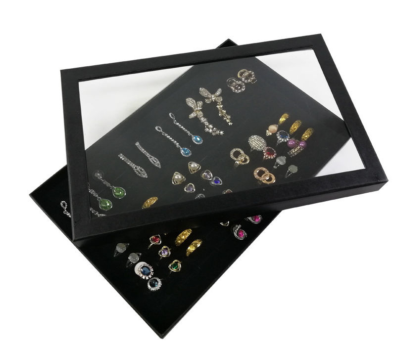 100 Slots Jewelry Ring Display Organizer Tray with transparent cover, showcasing rings and earrings in an elegant black design.