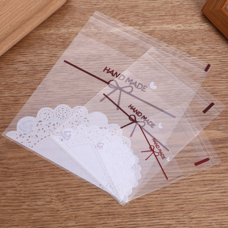 100pcs pack of 10x10cm white lace bow self-adhesive bags for baking, ideal for cookies and treats.