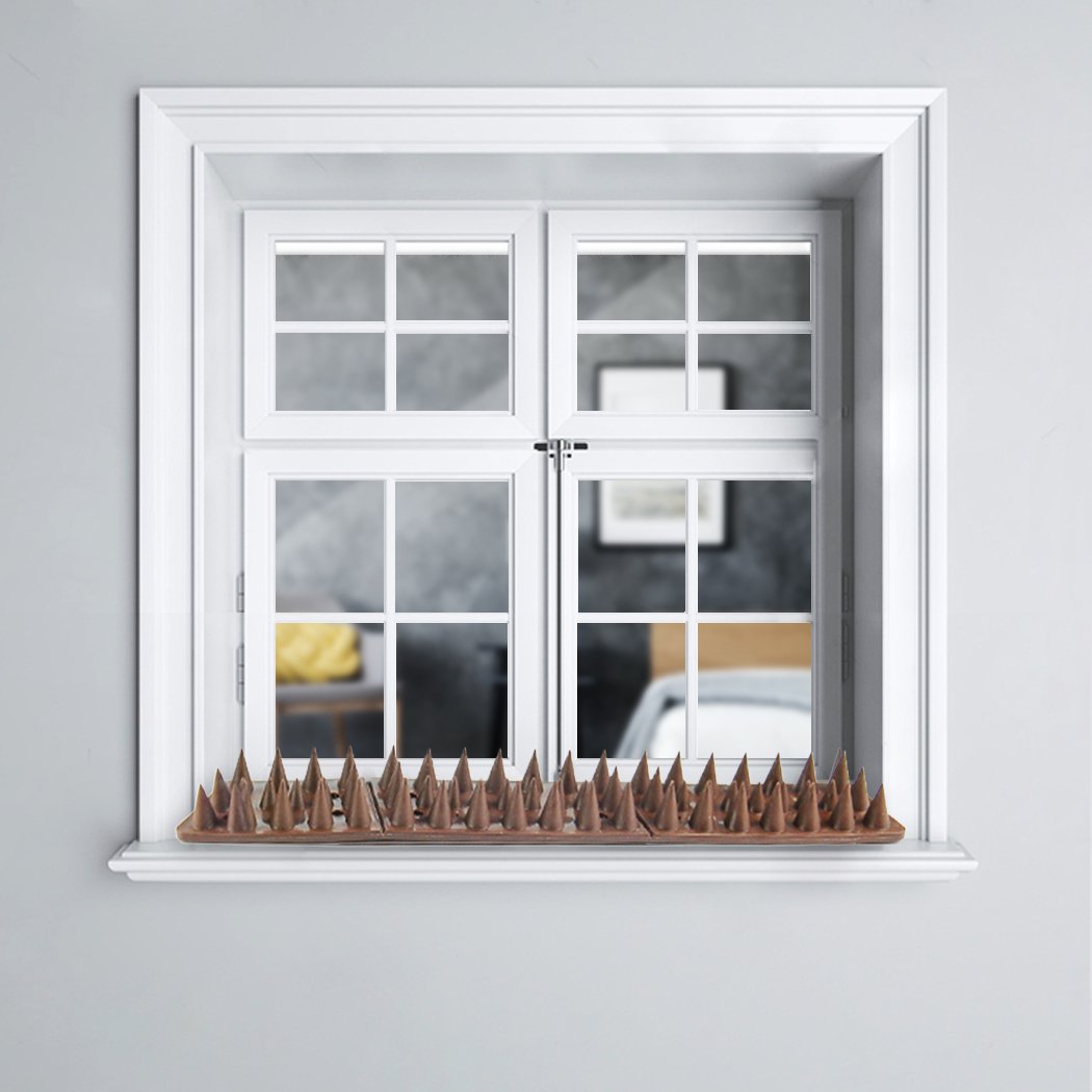 10x Bird Spikes for pest control, designed to deter birds, cats, and rodents from fences and walls, featuring a brown color and flat style.