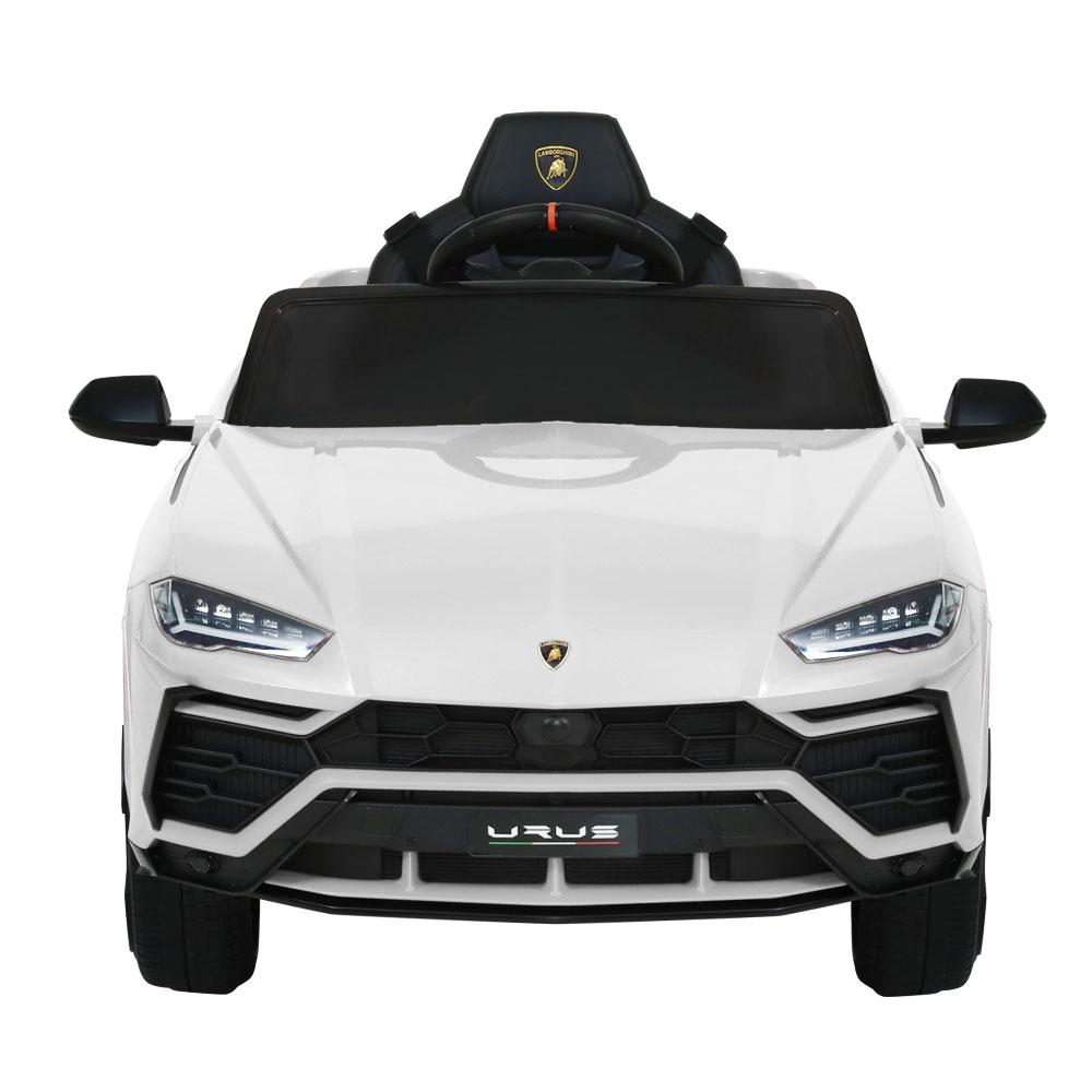 A white 12V Electric Kids Ride On Toy Car designed as a licensed Lamborghini URUS, featuring stylish working doors, headlights, and a digital dashboard.