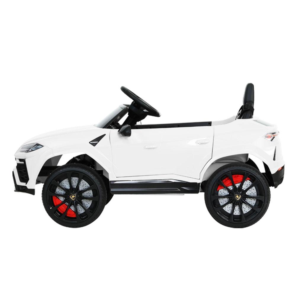 A white 12V Electric Kids Ride On Toy Car designed as a licensed Lamborghini URUS, featuring stylish working doors, headlights, and a digital dashboard.