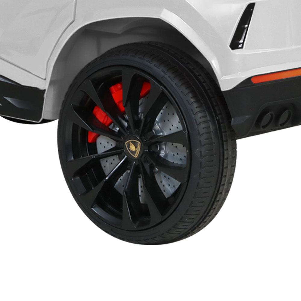 A white 12V Electric Kids Ride On Toy Car designed as a licensed Lamborghini URUS, featuring stylish working doors, headlights, and a digital dashboard.