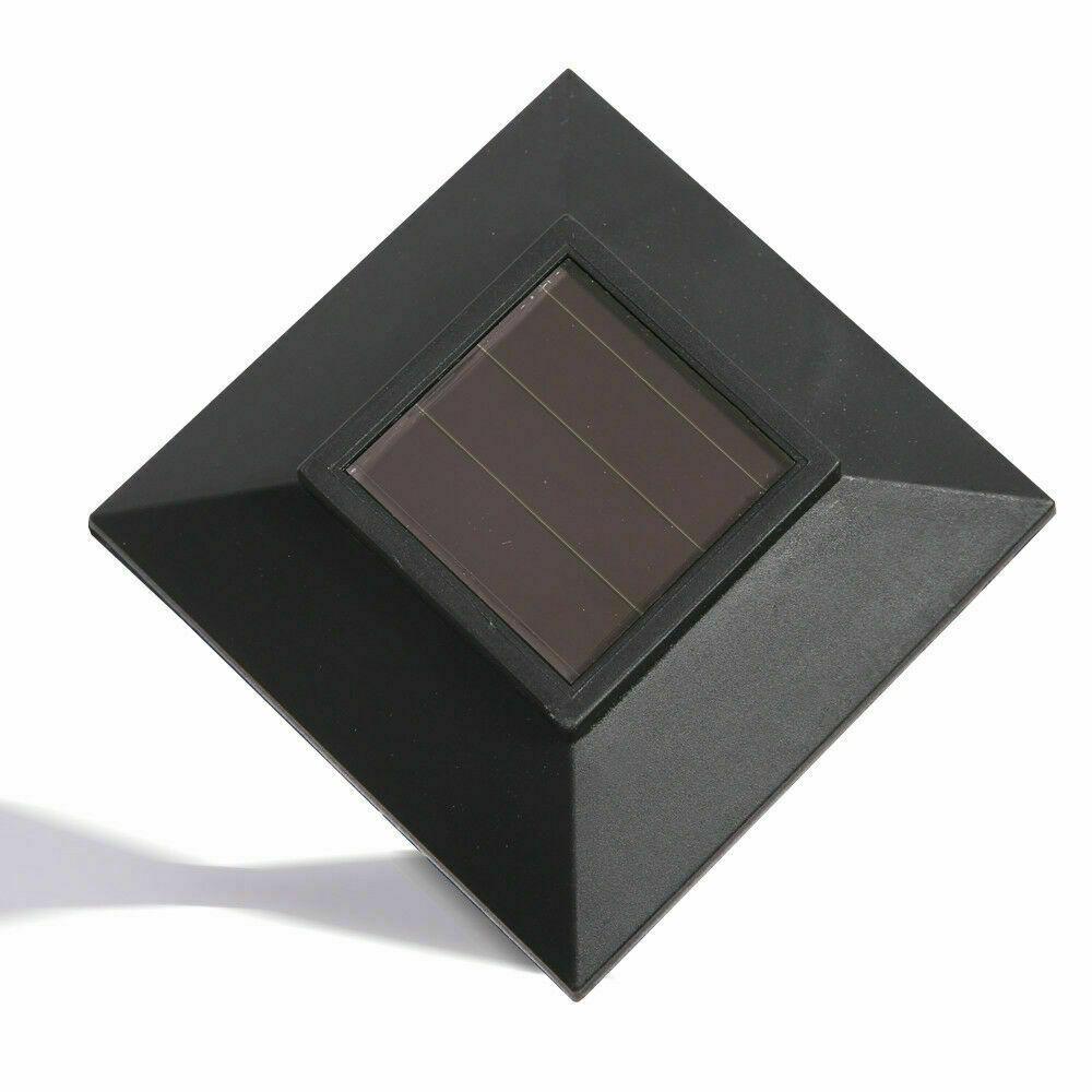 A set of 12 LED solar-powered garden lights illuminating a pathway, showcasing their sleek design and bright white light.