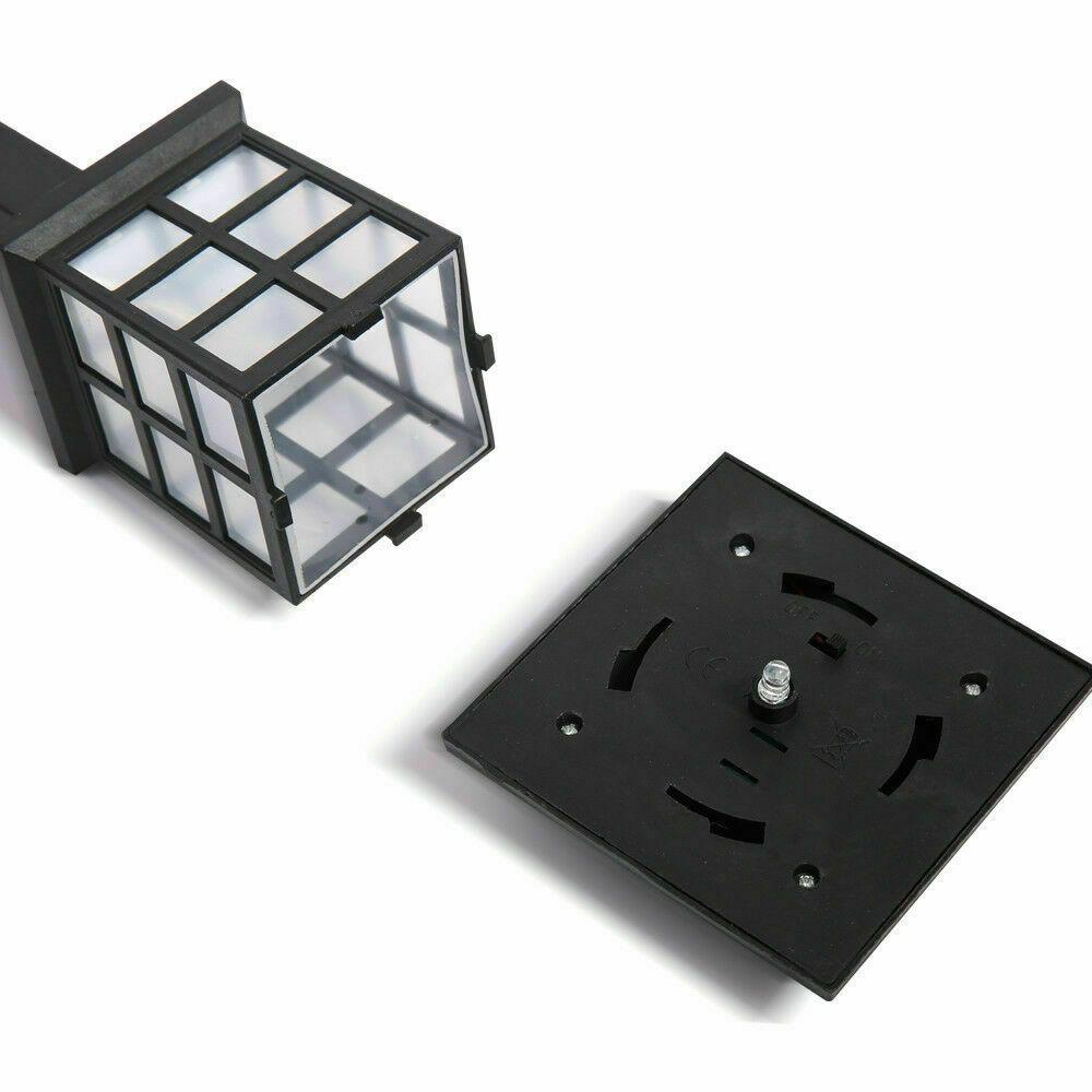 A set of 12 LED solar-powered garden lights illuminating a pathway, showcasing their sleek design and bright white light.