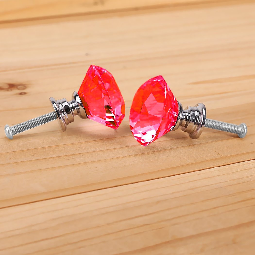 A set of 16 clear crystal knobs shaped like diamonds, each with a 40mm diameter, showcasing their elegant design and shiny surface.