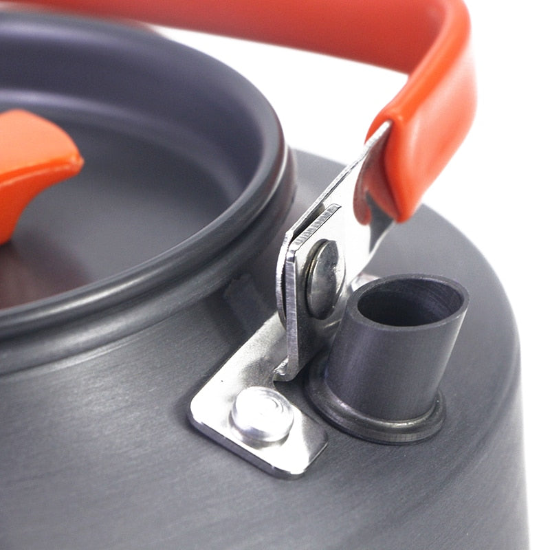 1.1L Camping Water Kettle made of aluminium alloy, perfect for outdoor coffee and cooking, shown in a natural setting.