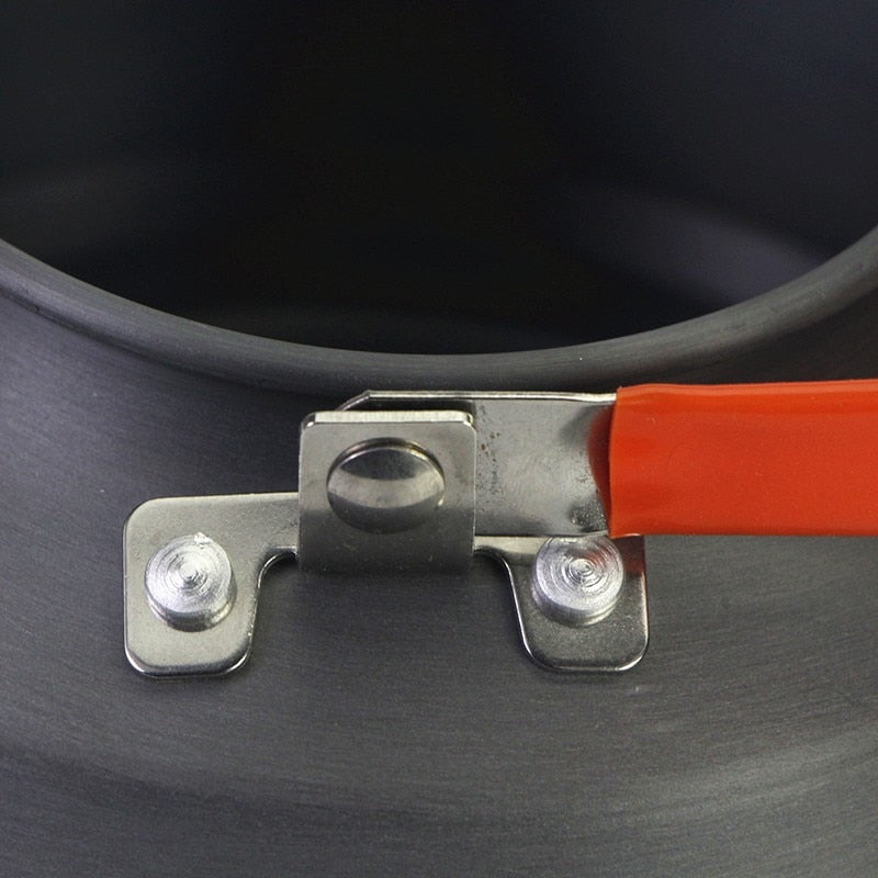 1.1L Camping Water Kettle made of aluminium alloy, perfect for outdoor coffee and cooking, shown in a natural setting.