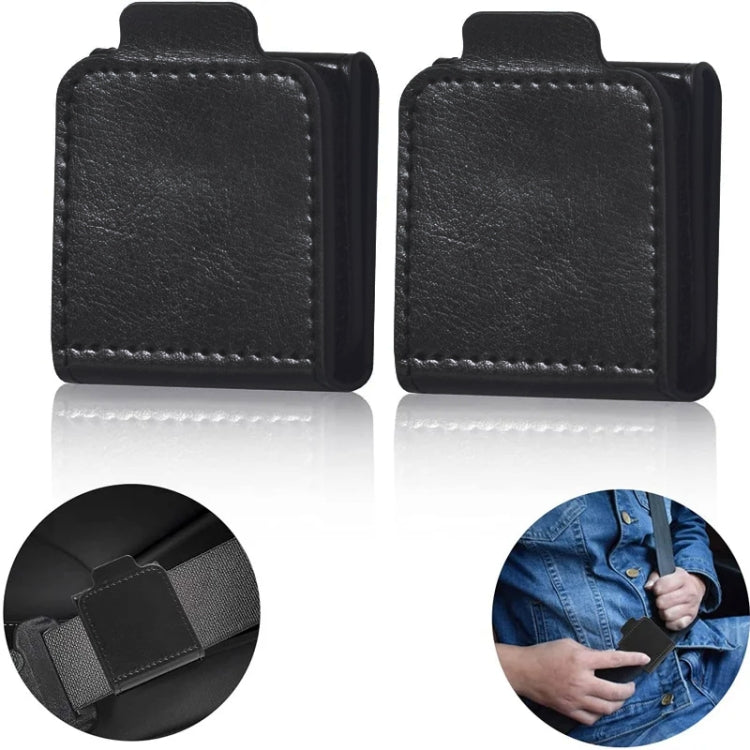 A pair of black car seat belt anti-strangle adjusters designed for children and adults, showcasing their compact size and high-quality leather material.