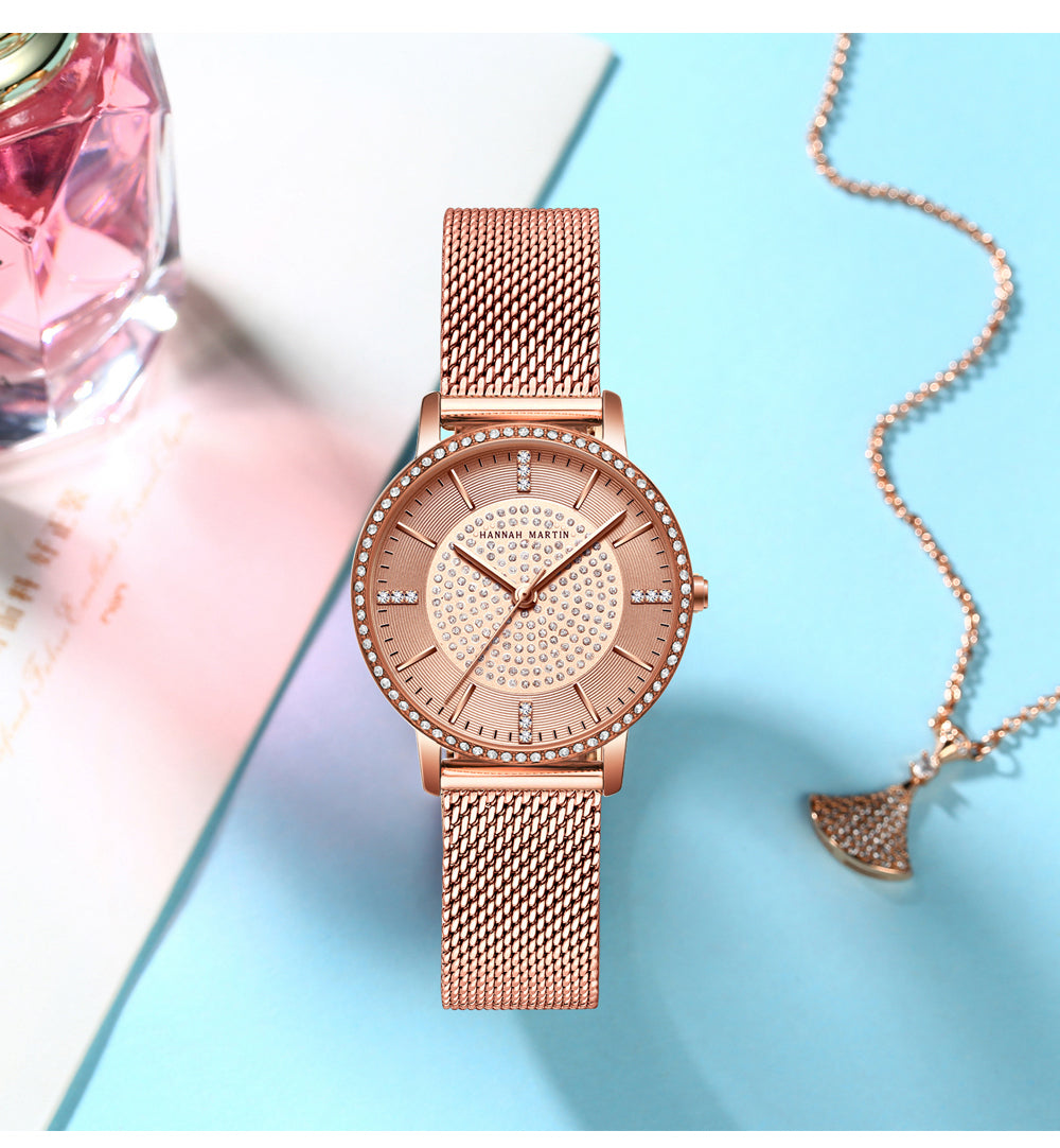 A luxurious women's bracelet watch featuring rhinestones and a quartz movement, elegantly designed with a brass case and stainless steel band.