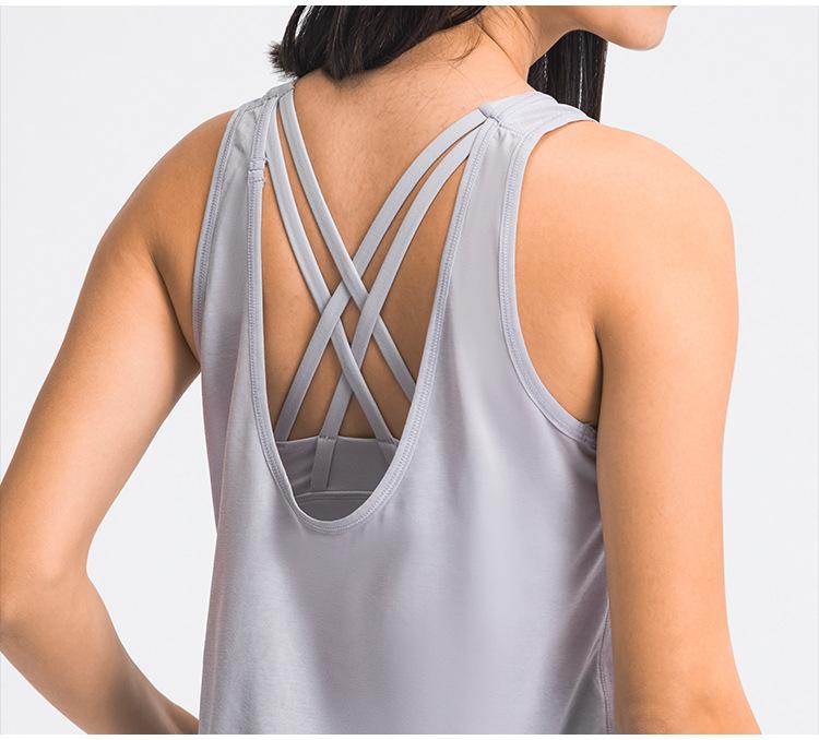 A stylish 2 in 1 loose U-back workout gym tank top for women, featuring a built-in bra, made from lightweight and breathable fabric, perfect for fitness activities.