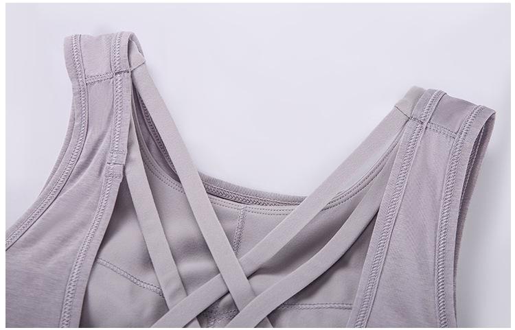 A stylish 2 in 1 loose U-back workout gym tank top for women, featuring a built-in bra, made from lightweight and breathable fabric, perfect for fitness activities.