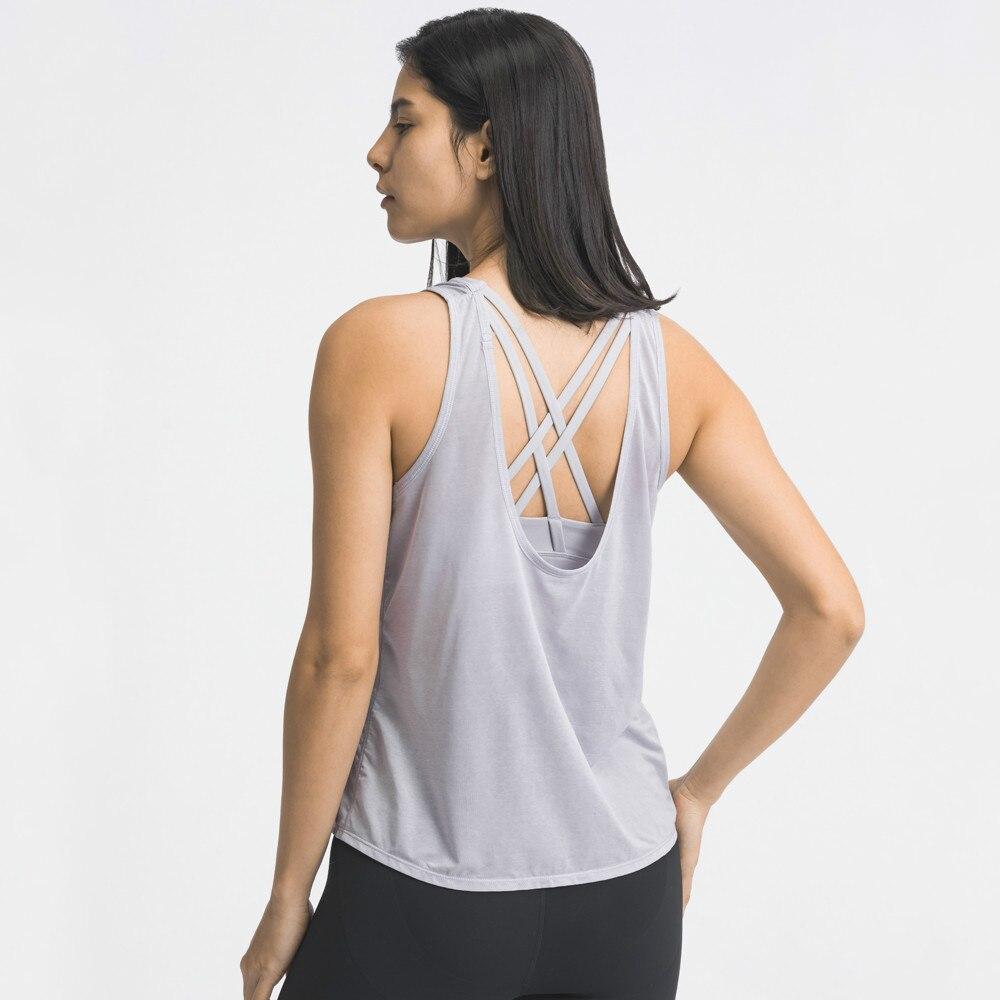 A stylish 2 in 1 loose U-back workout gym tank top for women, featuring a built-in bra, made from lightweight and breathable fabric, perfect for fitness activities.