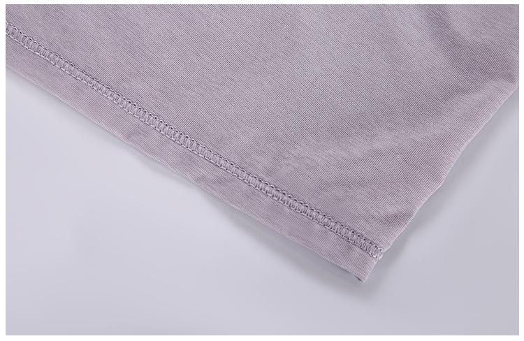 A stylish 2 in 1 loose U-back workout gym tank top for women, featuring a built-in bra, made from lightweight and breathable fabric, perfect for fitness activities.