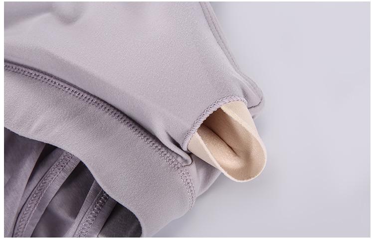 A stylish 2 in 1 loose U-back workout gym tank top for women, featuring a built-in bra, made from lightweight and breathable fabric, perfect for fitness activities.