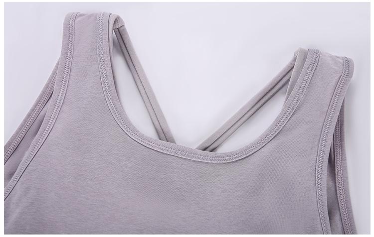 A stylish 2 in 1 loose U-back workout gym tank top for women, featuring a built-in bra, made from lightweight and breathable fabric, perfect for fitness activities.
