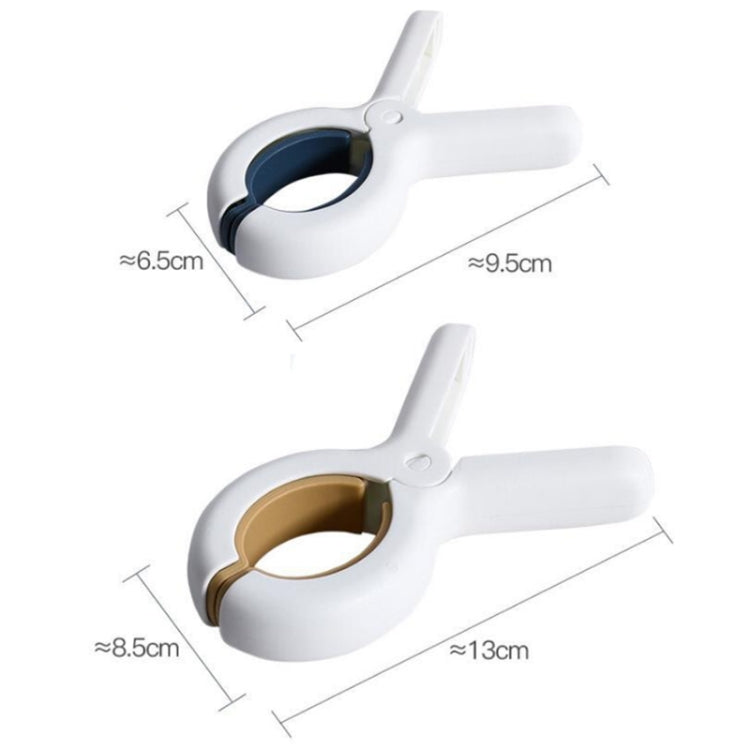 Two large blue plastic windproof clothespins designed for household use, showcasing their strong grip and durable material.