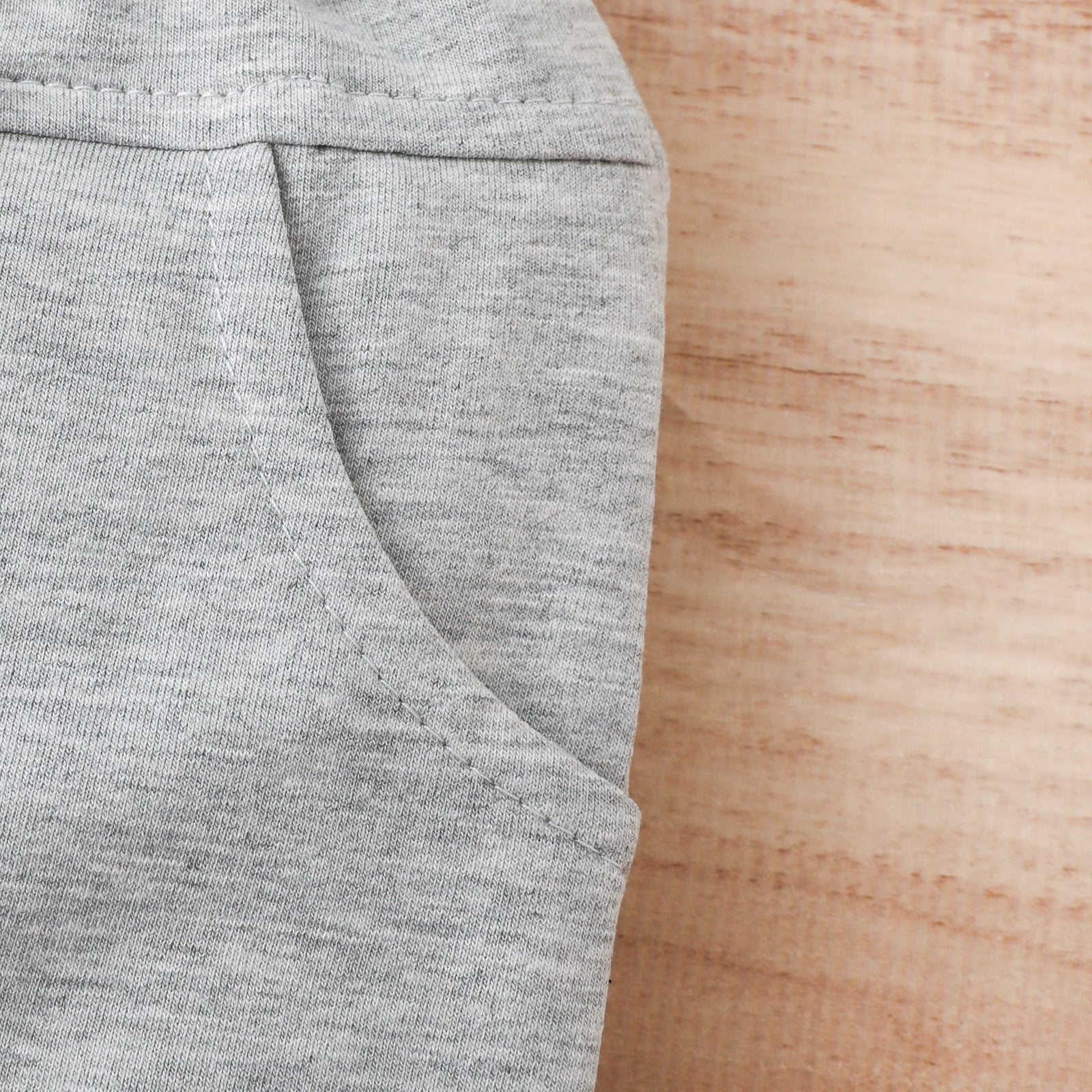 A stylish 2-piece set for babies featuring a letter-patterned T-shirt and solid color shorts, perfect for summer wear.