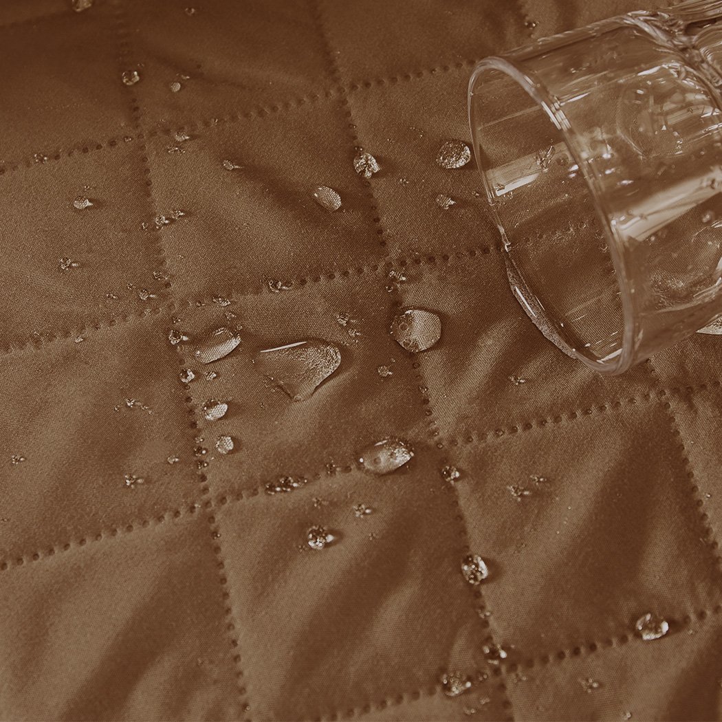 Brown quilted 2 seater sofa cover with microfiber filling, showcasing its anti-slip base and well-stitched edges.